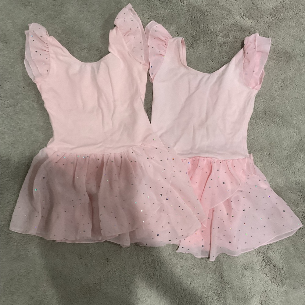 Two pink ballet dresses